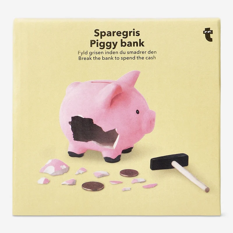 Pink piggy bank with hammer