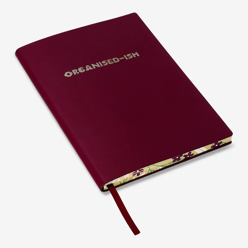 Burgundy notebook with text