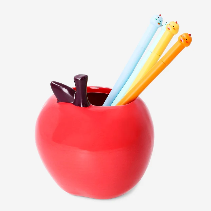 Ceramic pencil holder as red apple