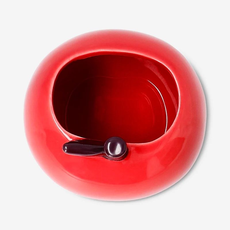 Ceramic pencil holder as red apple
