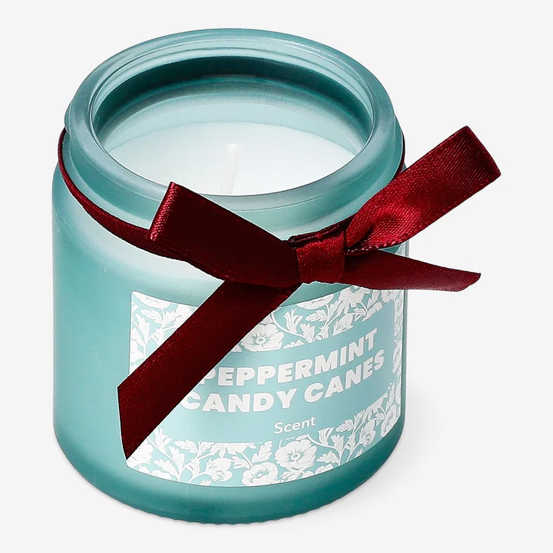 Scented candle with candy cane fragrance