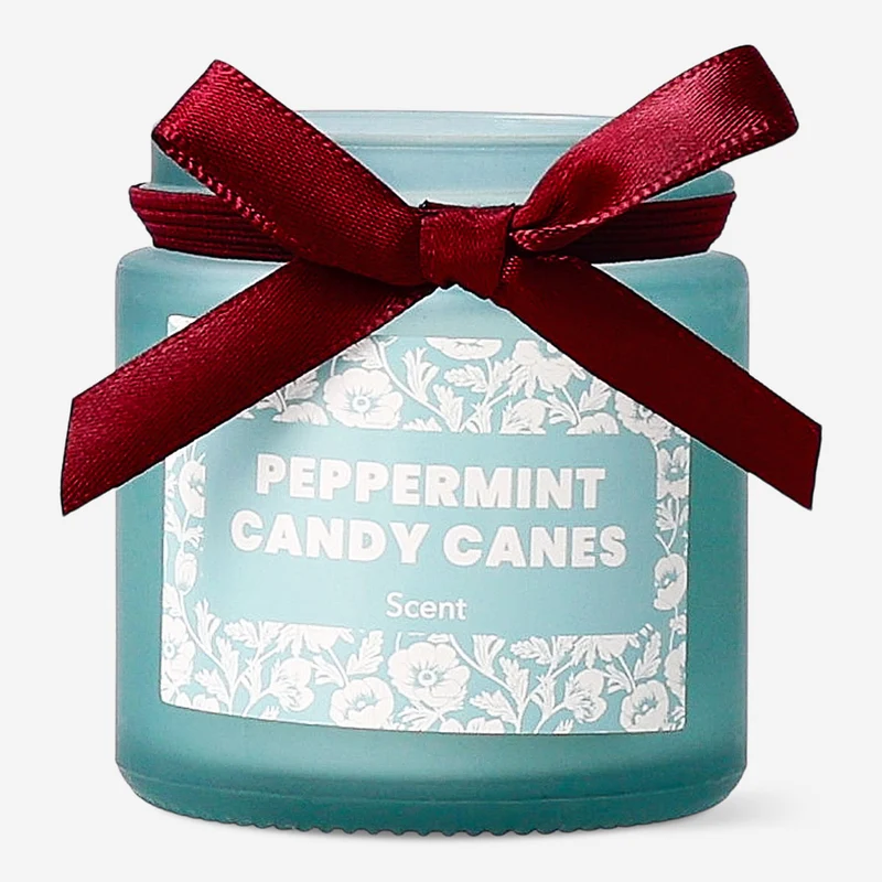 Scented candle with candy cane fragrance