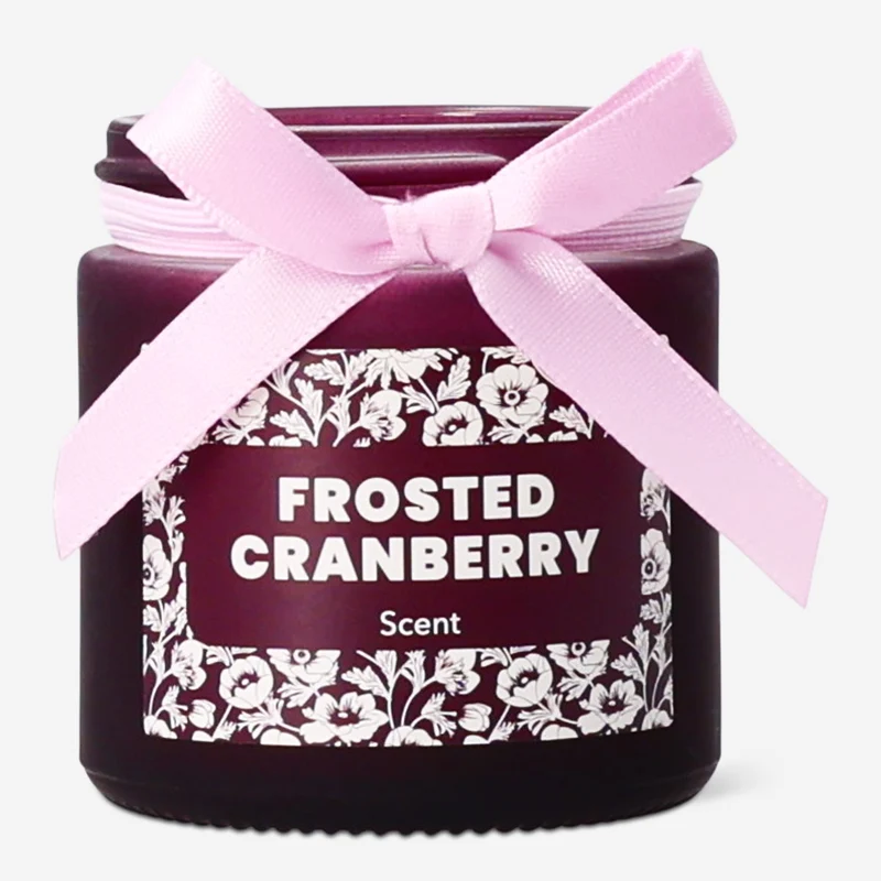 Scented candle with frosted cranberry fragrance