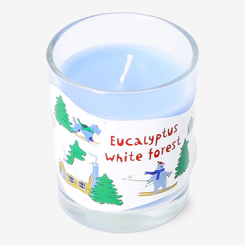Scented candle with eucalyptus and white forest fragrance