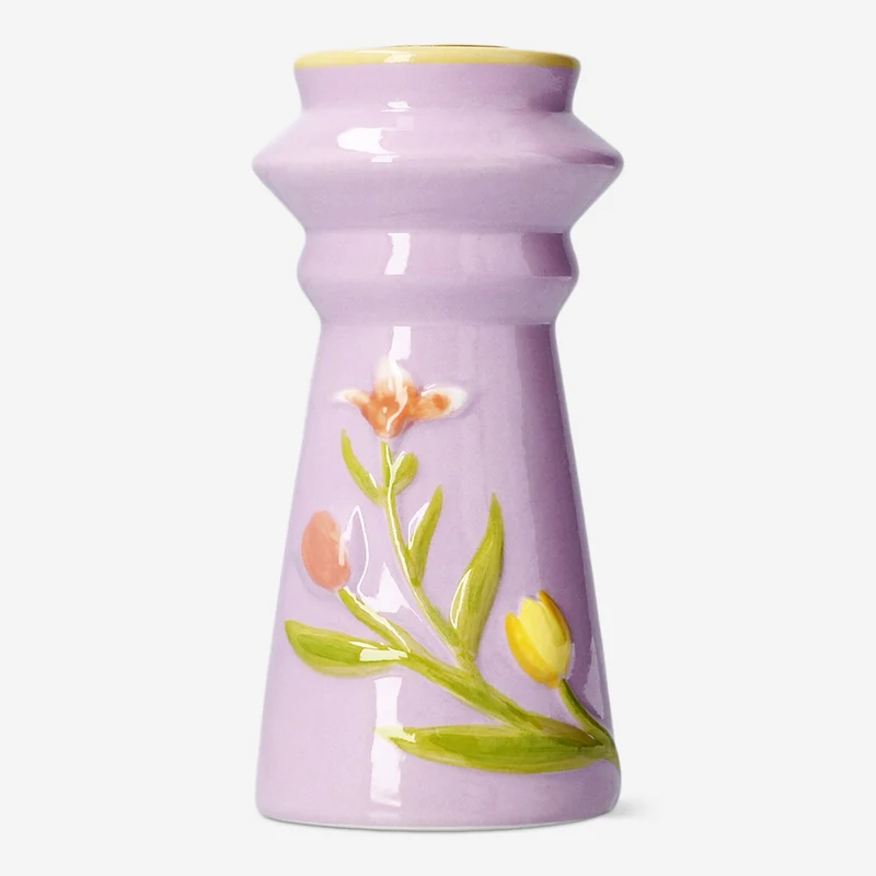 Candle holder with embossed flowers