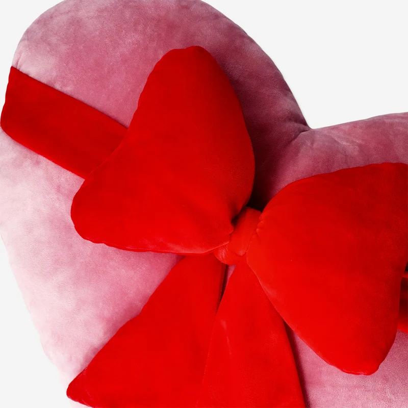 Red heart with bow cushion