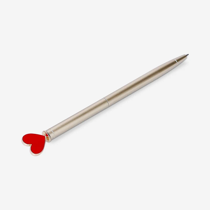 Gold ballpoint pen with heart topper