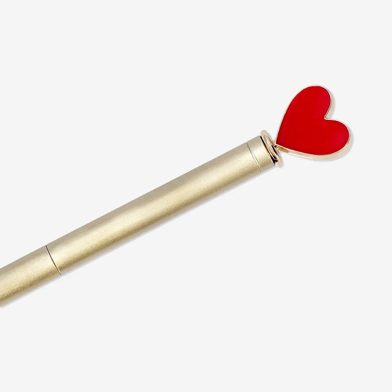 Gold ballpoint pen with heart topper