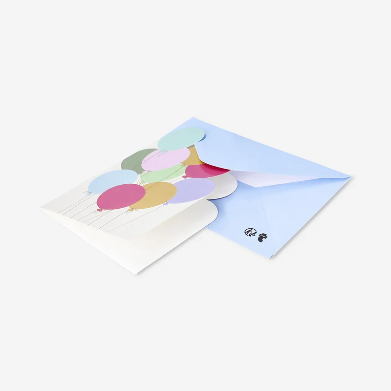 Greetings card with cut out balloons