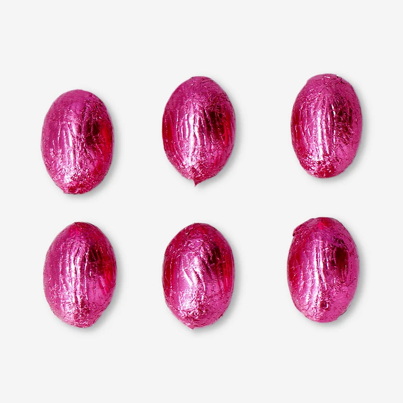 Pink milk chocolate eggs in net with milky cream filling and brownie