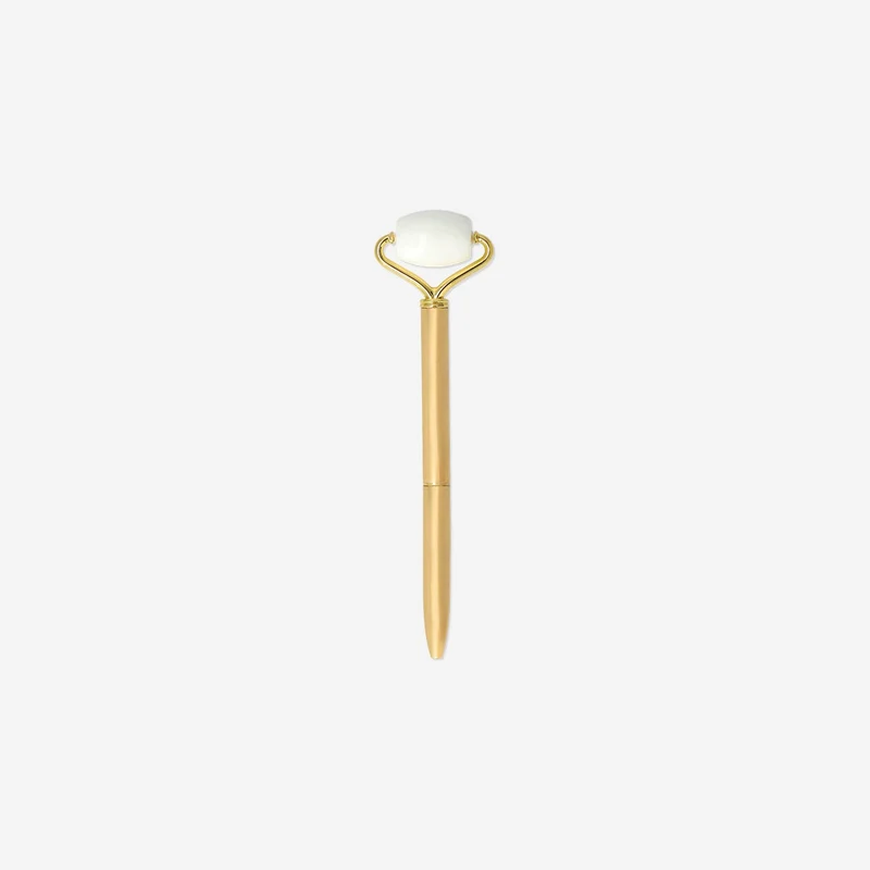 Gold ballpoint pen with facial massager