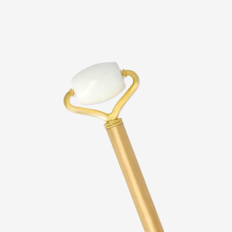 Gold ballpoint pen with facial massager