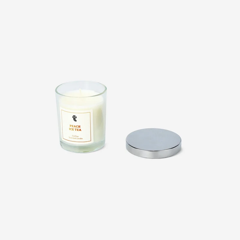 Scented candle with peach fragrance