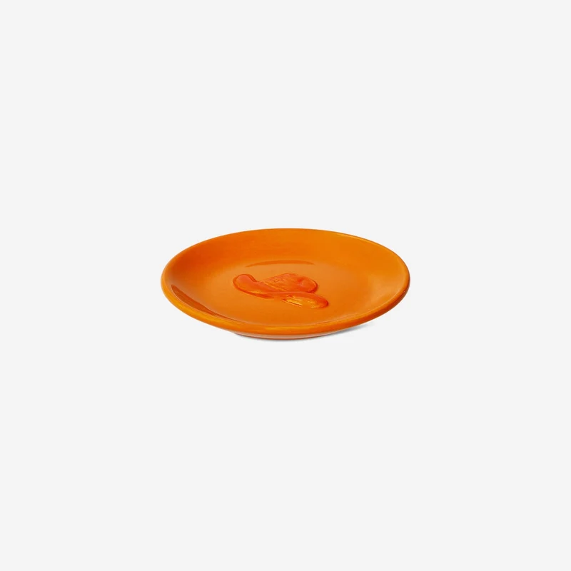 Orange dish with cowboy hat