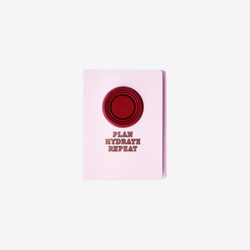 Pink notebook with cup
