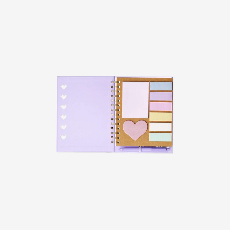 Purple notebook with ballpoint pen and sticky memos