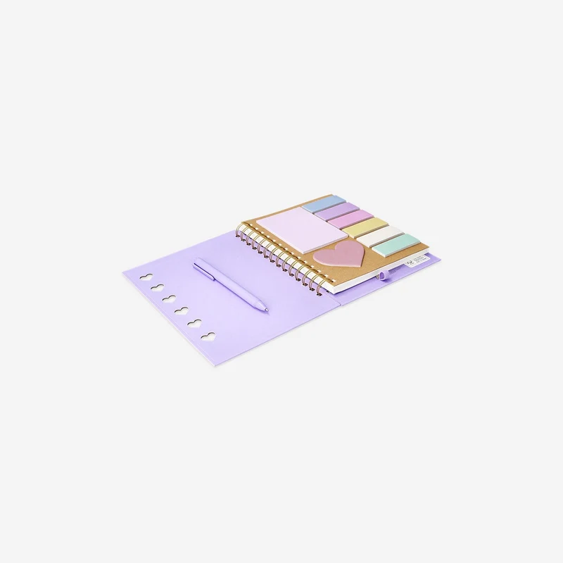 Purple notebook with ballpoint pen and sticky memos