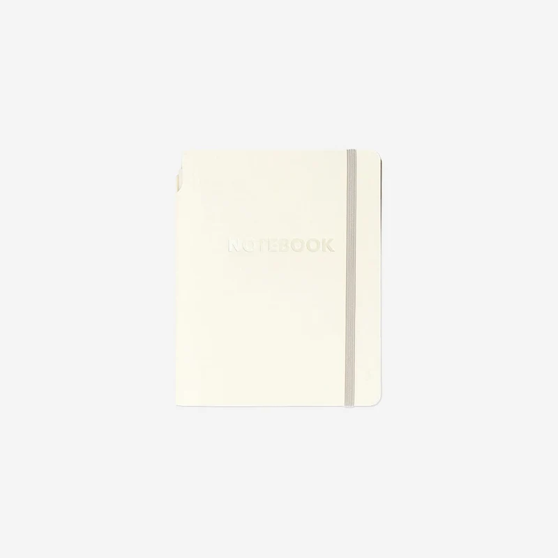 Beige notebook with ballpoint pen