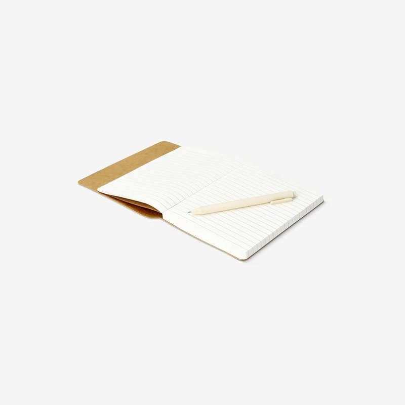 Beige notebook with ballpoint pen