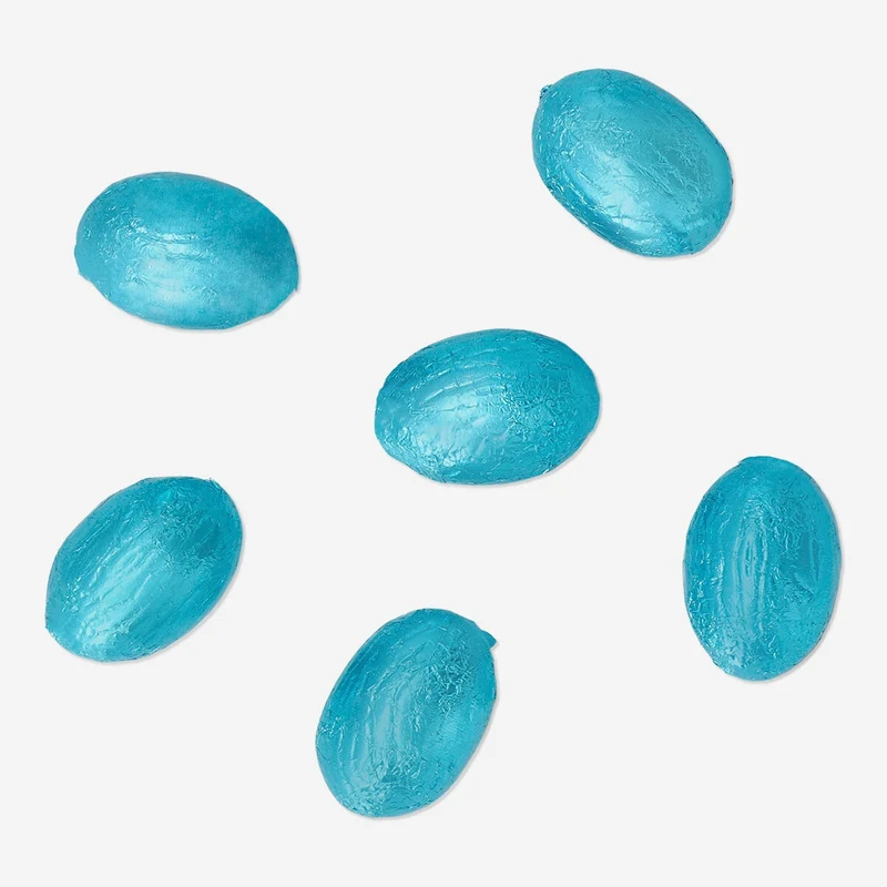 Blue milk chocolate eggs in net with popping candy